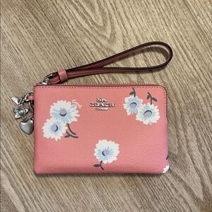 Coach Pink Wristlet with White Floral Design